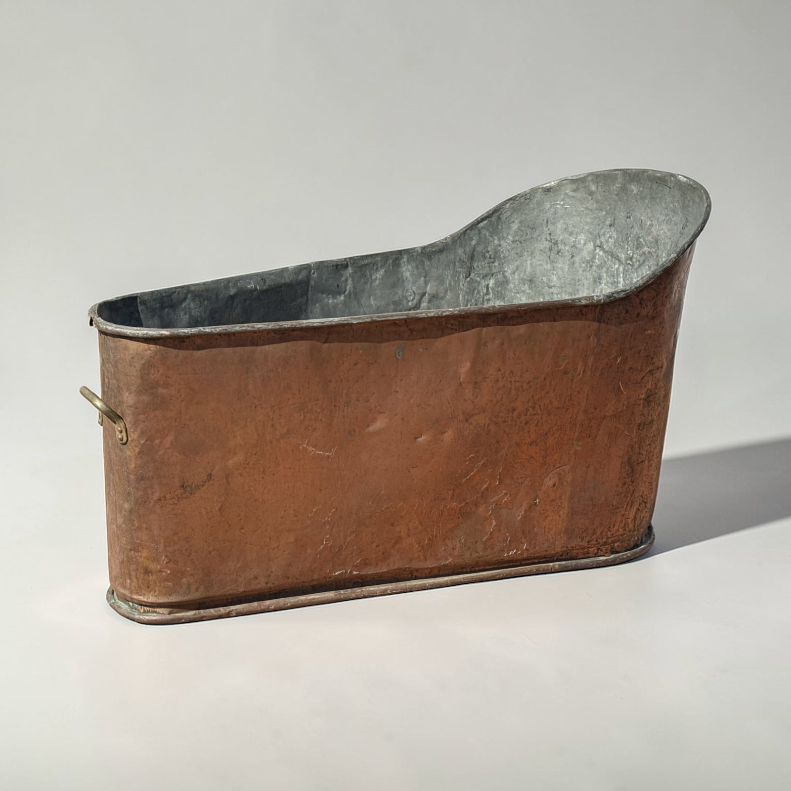 19th C French Copper Bath Tub: Measures 31.5" H x 23.5" H on the low end x 53" L x 26" W.