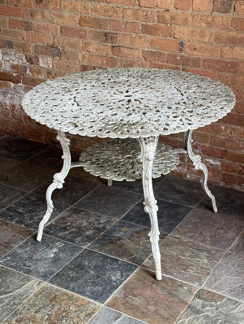 Victorian Style Garden Table: Cast metal, likely aluminum. Measures 28" H x 39" Diameter.
