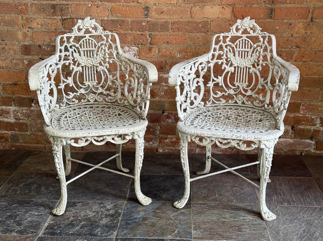 Pair of Victorian Style Cast Iron Garden Chairs: Cast metal, likely aluminum. 31" H to back x 14" H to seat x 21" W x 21" D.