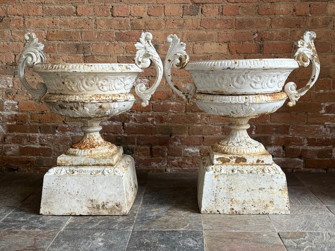 Pair of Antique Victorian Cast Iron Garden Urn Planters: Measures 34" H to handle x 27.75" H to rim x 29" overall Diameter x 19" inner Diameter. Base measures 16.25 " W x 16.25" D. Each comes apart in 4 pieces.