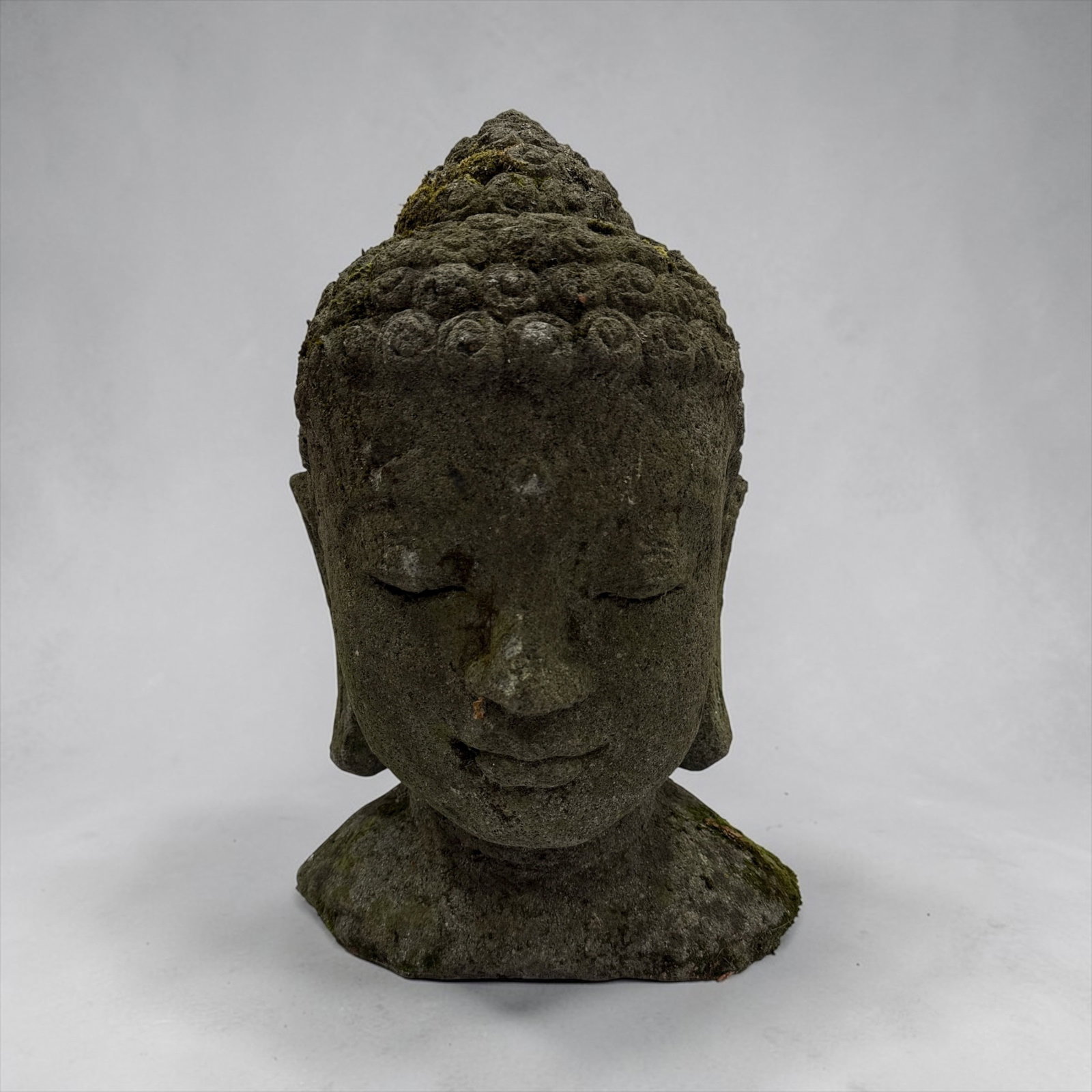 Late 19th / Early 20th C. Stone Buddha Head Sculpture: Concrete. 16" H x 10.5" W x 8" D.