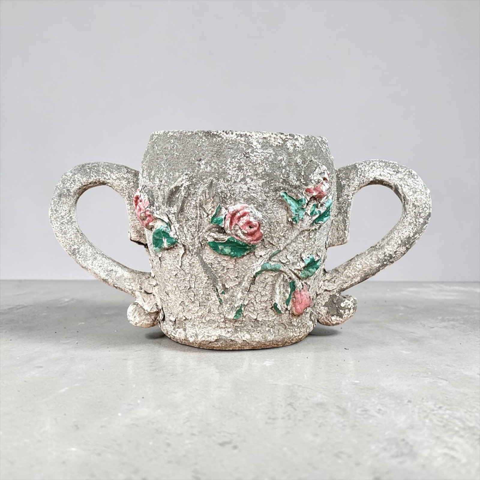 Late 19th / Early 20th C. Double Handle Rose Garden Planter: Concrete. 13" H x 24" W x 12" overall diameter x 8" internal diameter.