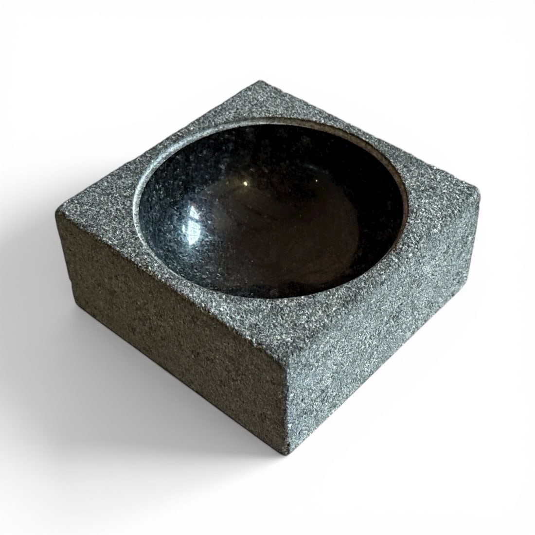 POUL KJAERHOLM (Danish, 1929-1980) "PK-Bowl": PK-Bowl, designed 1963, produced 2011Granite. Manufactured by Architect Made, Denmark.Underside with manufacturer's sticker with title, designer signature and "No. 096/2010.".