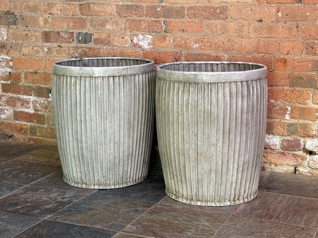 Pair of English Dolly Tub Planters: Measures 20.5" H x 17.5" Diameter. Zinc dolly tub planters made by Sundance, drilled at the bases for drainage.