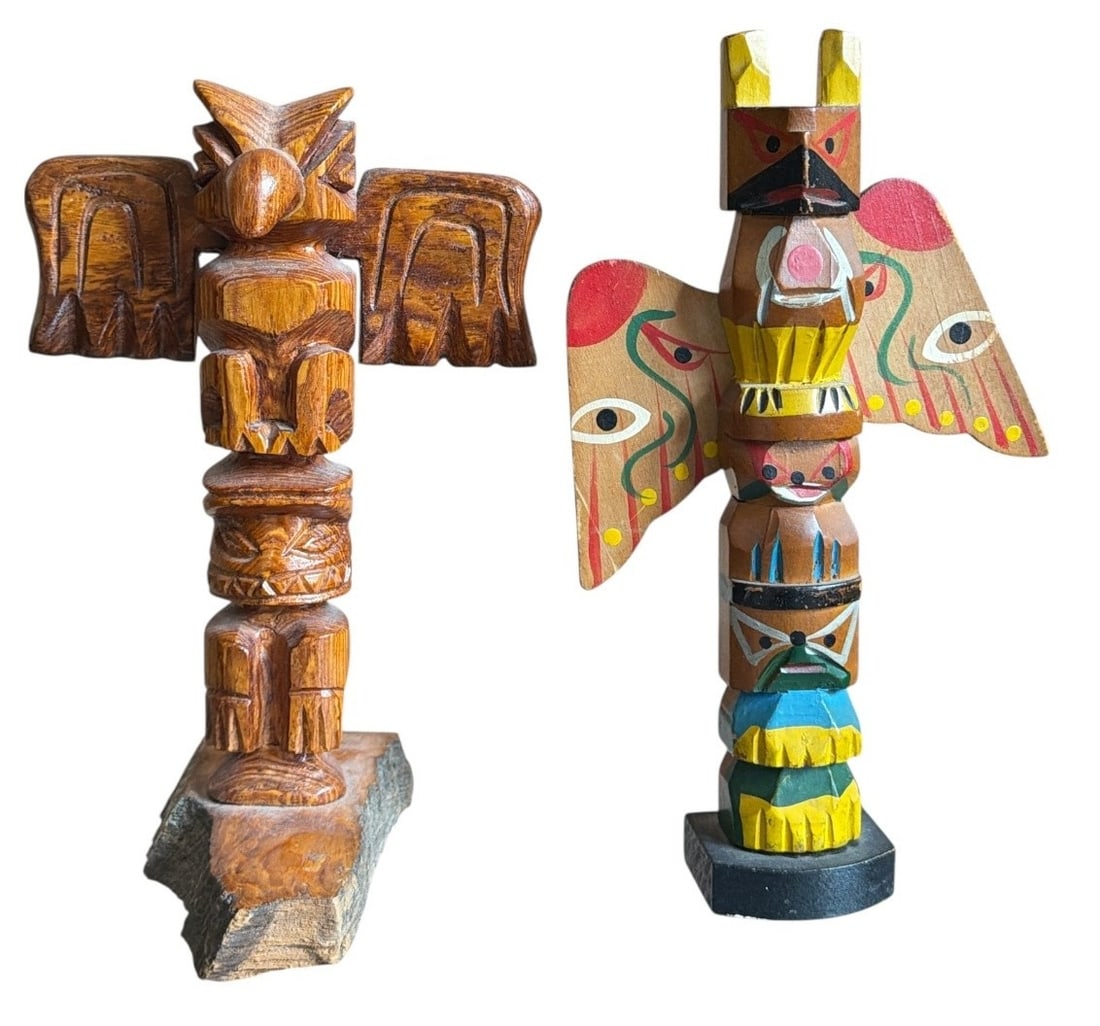 Two Alaskan Carved Wood Totem Poles: Left measures 8" H x 5" W x 4" D. Right measures 8.5" H x 5" W x 1.5" D.