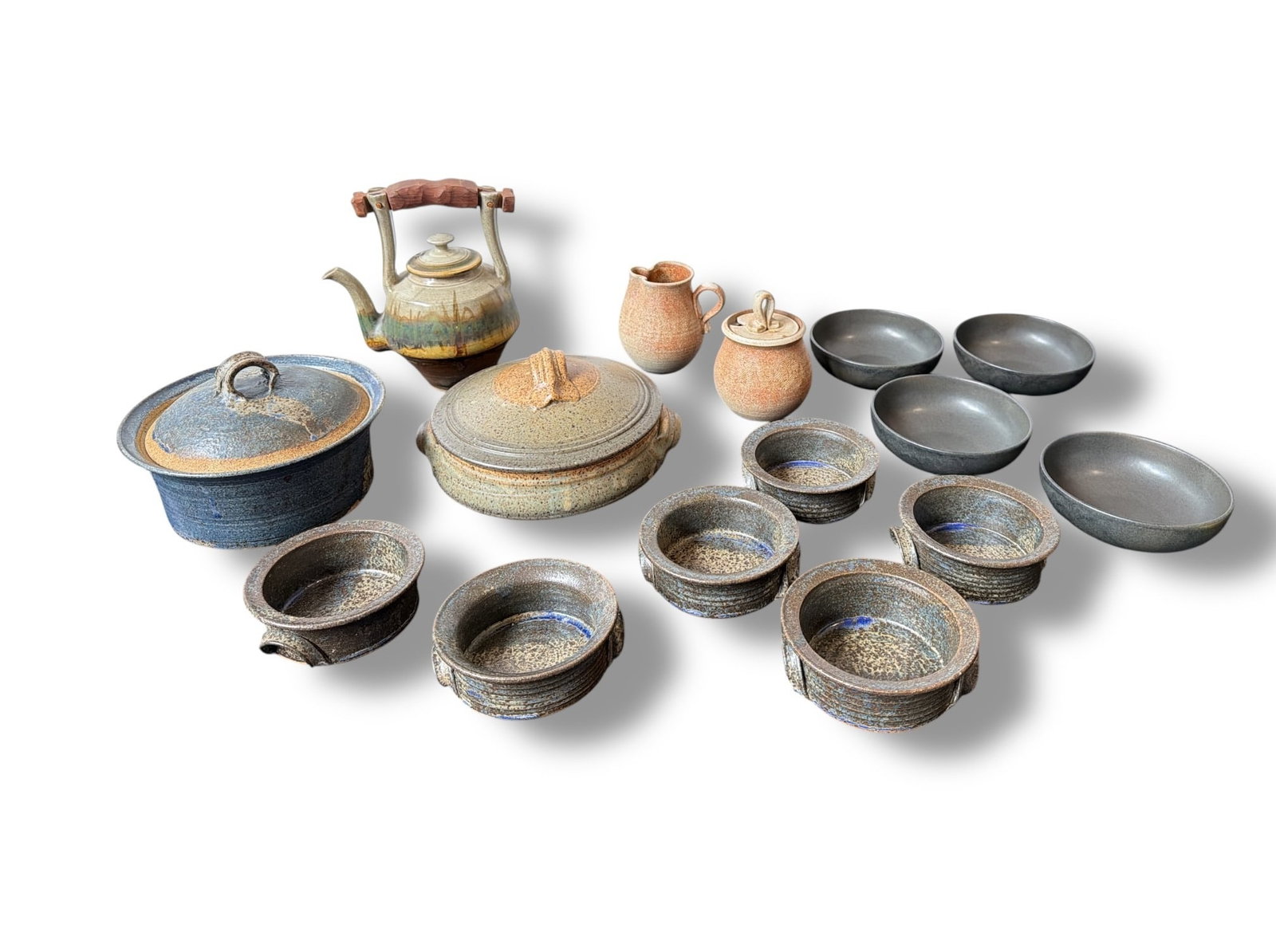 Large Collection of Studio Pottery, Lidded Dishes, and Bowls: Largest lidded dish measures 6" H x 9.5" Diameter. Teapot measures 9.5" H x 9" W x 5" Diameter.