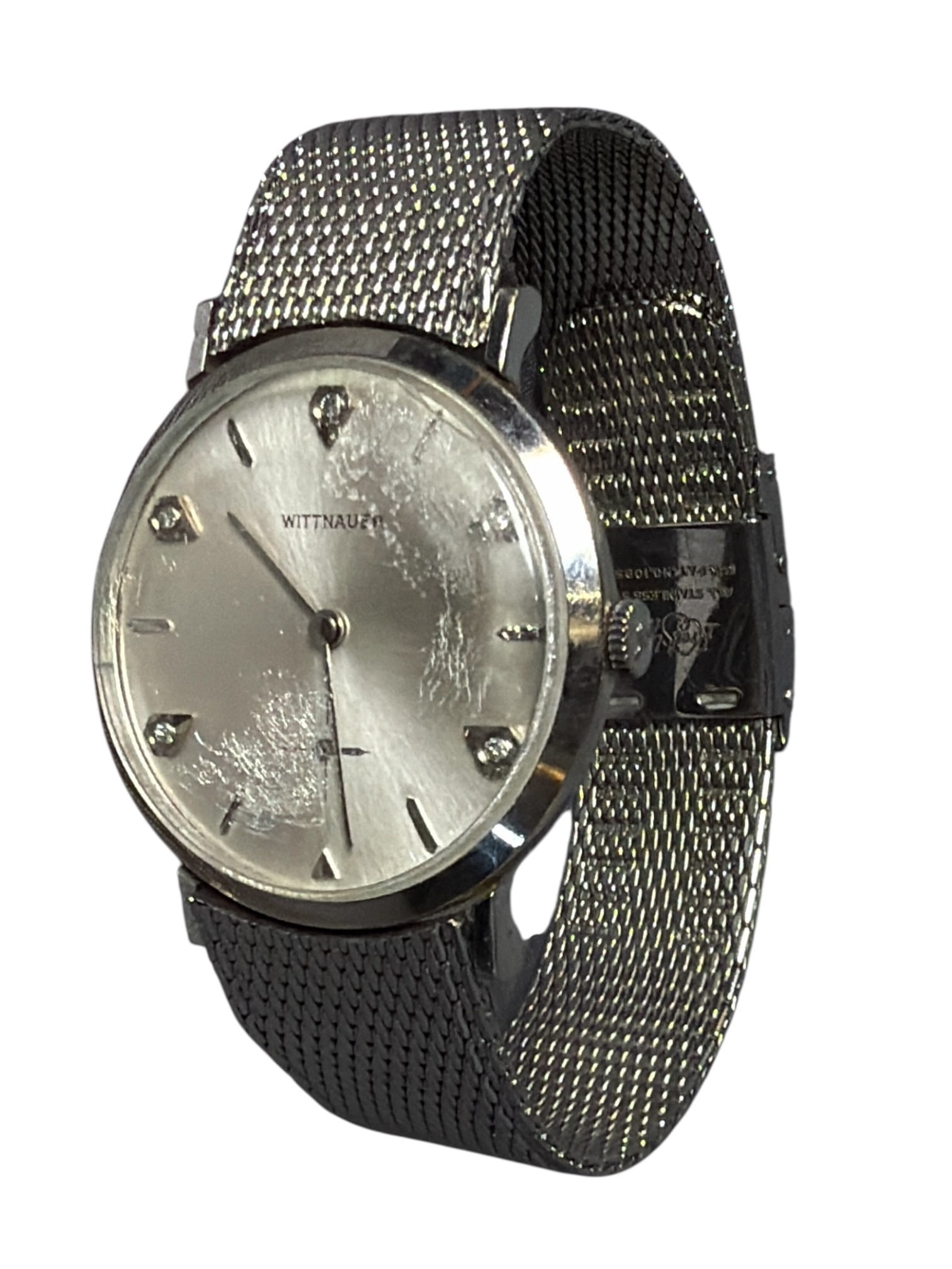 Vintage WITTNAUER 10K Gold Filled Watch: Total length of 7", clock face measures 1.25" diameter. Features 10k gold filled watch and diamond chips on the face.