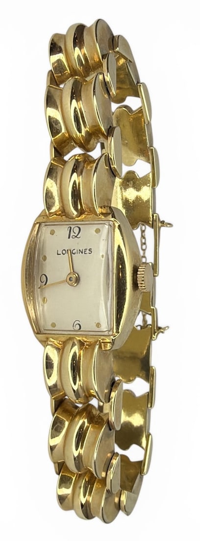 A Vintage 14k Gold LONGINES Watch: Approx 7" band and watch, 22.15" dwt. Inscribed 12-25-47.