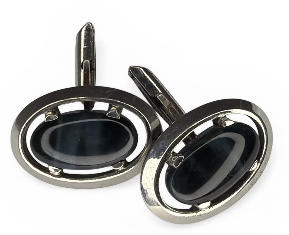 Vintage Sterling Cufflinks: Sterling silver and possible black cats eye stones. Each measures 1.25" x .75".