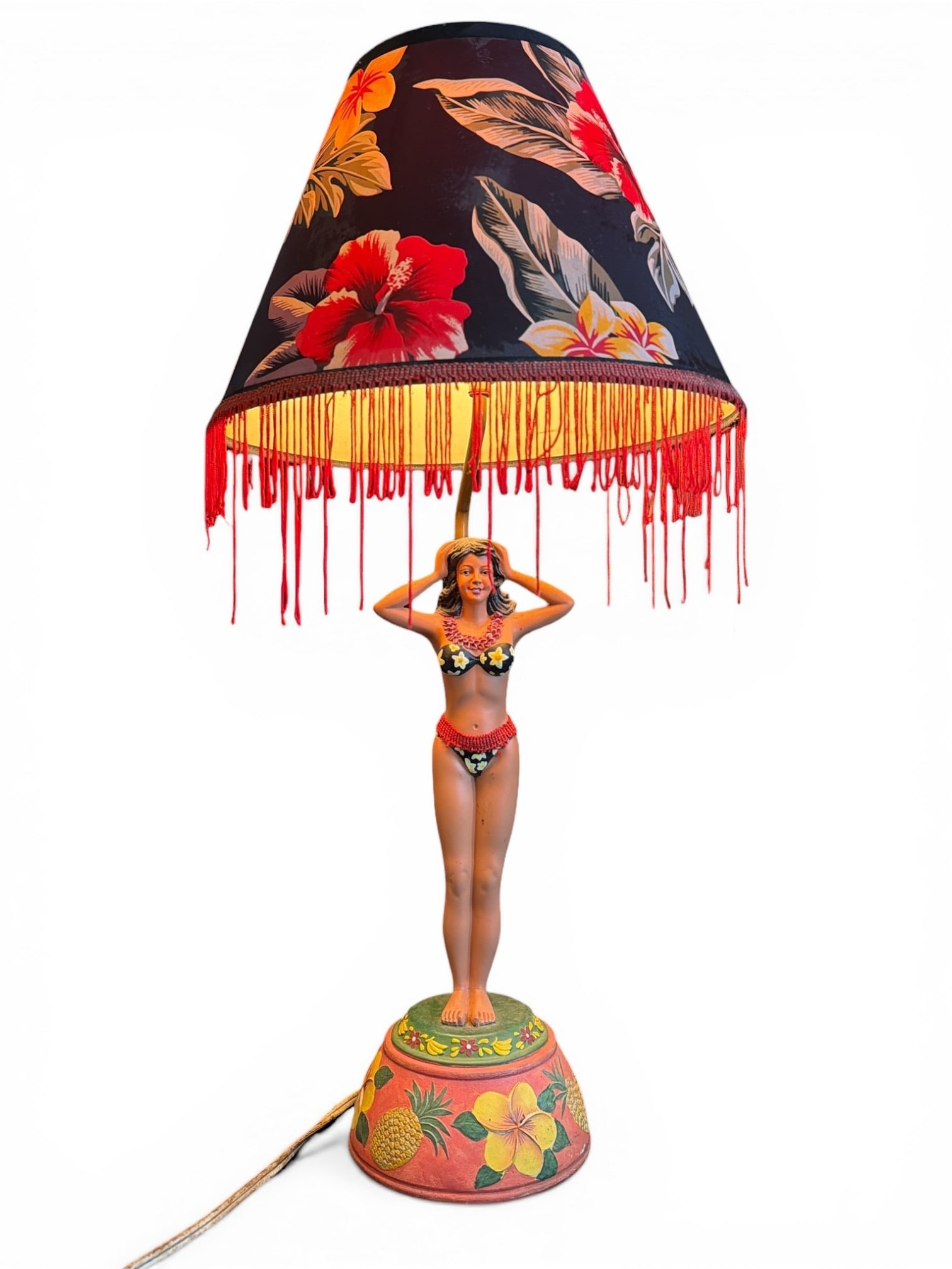 Mid Century Tiki Style Hula Dancer Lamp: Copyright 2000. Measures 26.5" H x 13" shade diameter, 6" diameter at the base.