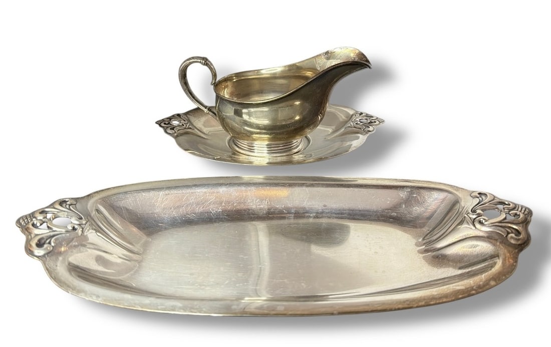 ROYAL DANISH Sterling Silver Serving Trays & Gravy Boat: The larger tray measures 1.5" H x 13" W x 5.75" D, the smaller tray measures 1" H x 9" W x 5.5" D, the gravy boat measures 4" H x 3.5" W x 7.5" D. Lot weighs 31.40ozt.