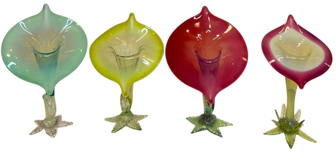 Four Leaf Base Victorian Uranium Glass Jack In The Pulpit Vases: Includes four ornate leaf based victorian uranium glass jack-in-the-pulpit vases. The taller ones measure 9" H x 6" x 3" D.
