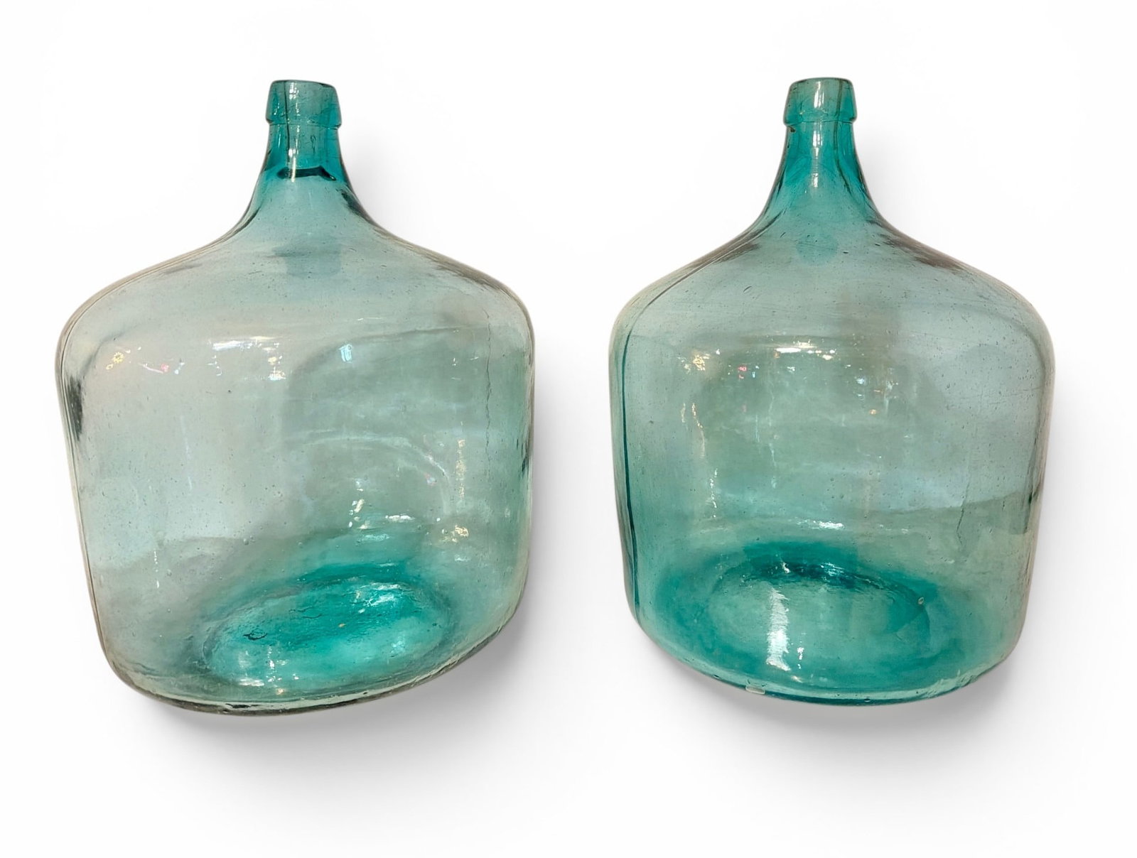Two French Aqua Blue Glass Demijohns: Each measures approx. 16" H x 13" overall diameter.