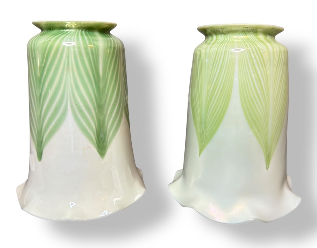 Two LOUIS COMFORT TIFFANY Favrile Pulled Feather Lamp Shades: Both are signed L.C.T Favrile. Both measure 5" H x 4" total shade diameter, fitter 2.25" diameter.