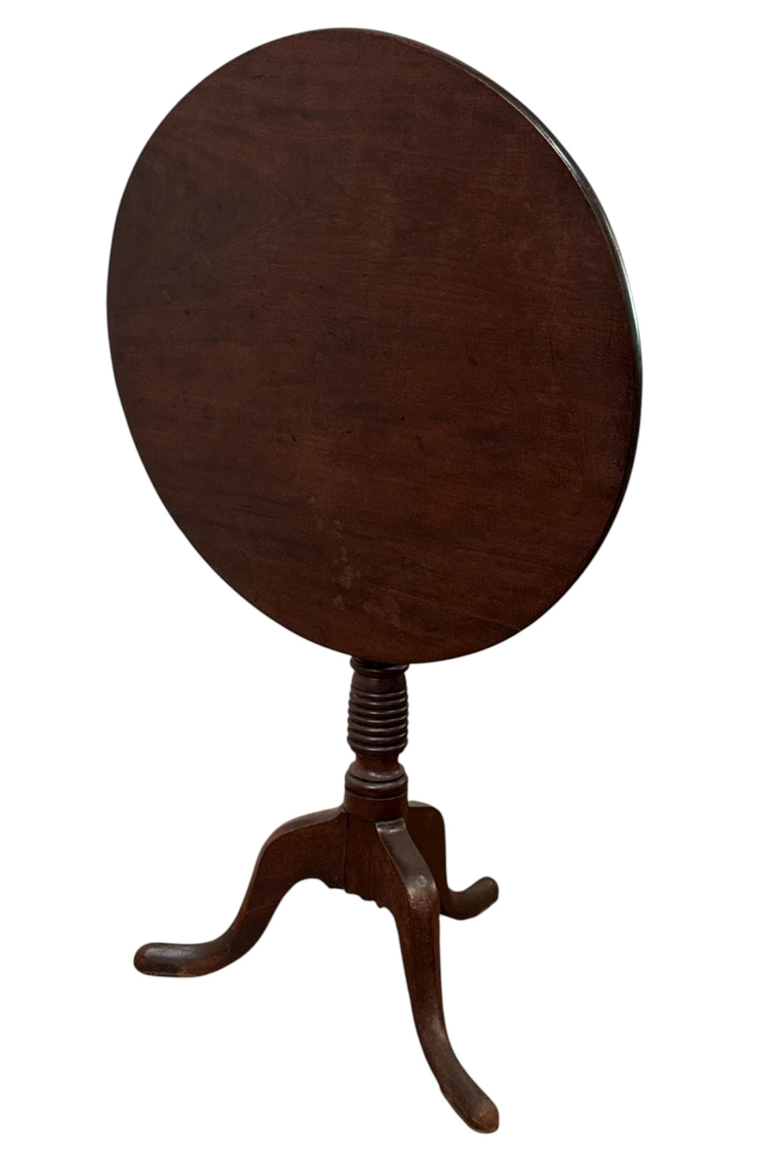 18th C. Georgian Tilt Top Table: Mahogany tilt-top table with snake feet and turned wood base. Measures 28" H x 23.5" diameter.