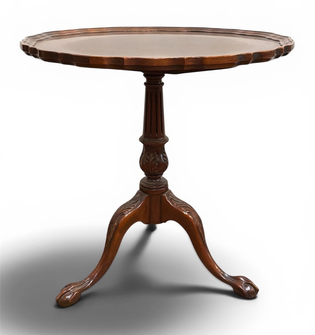 Chippendale Style Pie Crust Tilt Top Table: Ball and claw feet with carving throughout table base. Measure 30" H x 30.25" diameter. American Traditional .