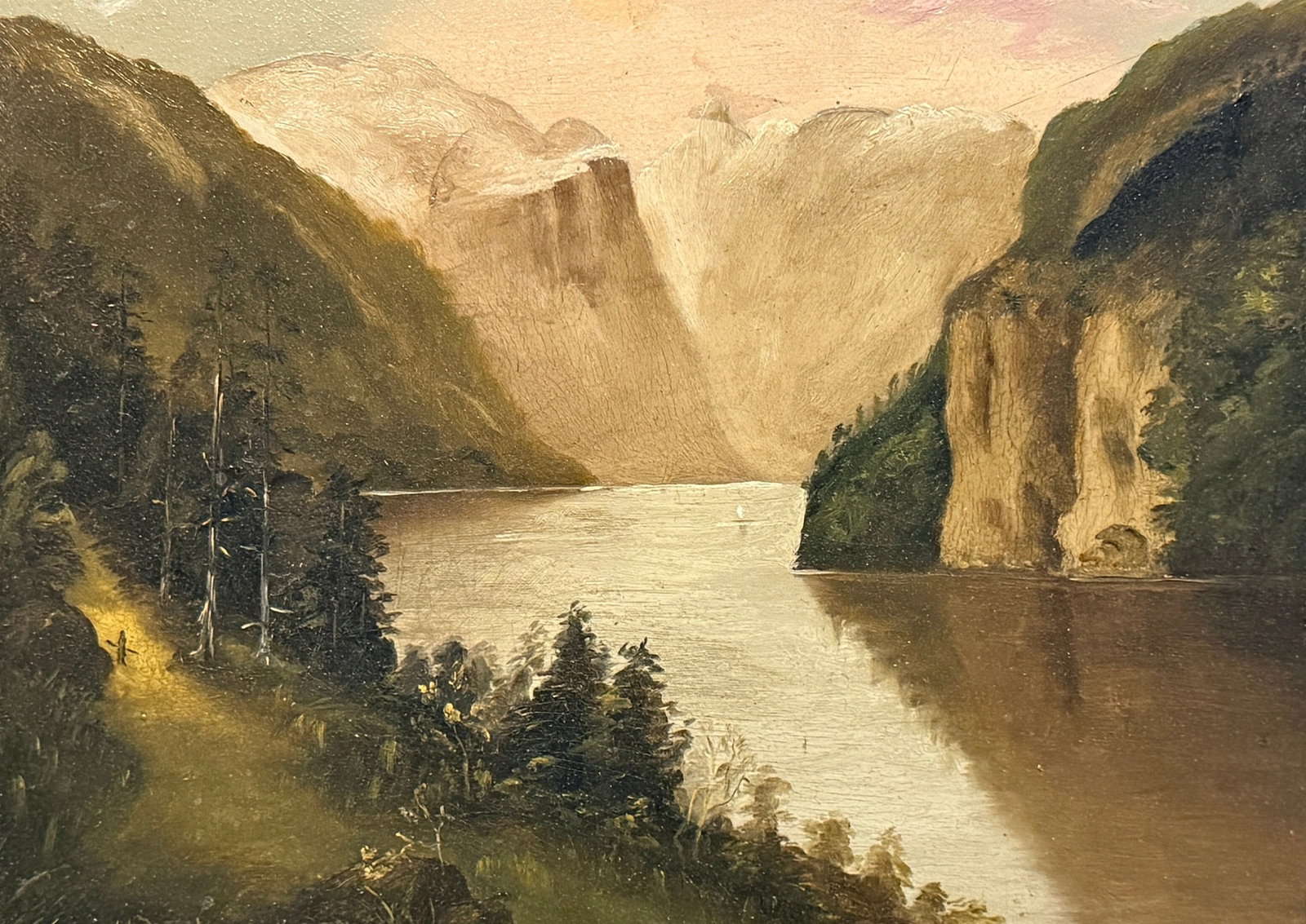 19th Century Alpine Landscape Oil Painting: Oil on board. Signed H.M.W. '94 on lower left. Measures 14.5" x 17.5" x 2" in the frame, sight measures 8.5" x 11.5". Detailed with diminutive surrealist figure on left side on landscapes incline, as 
