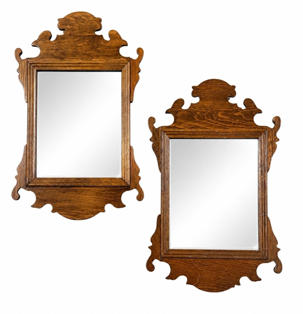 A Pair of Chippendale Wall Mirrors: Both measure 18.5" x 11.5" x 1" D.