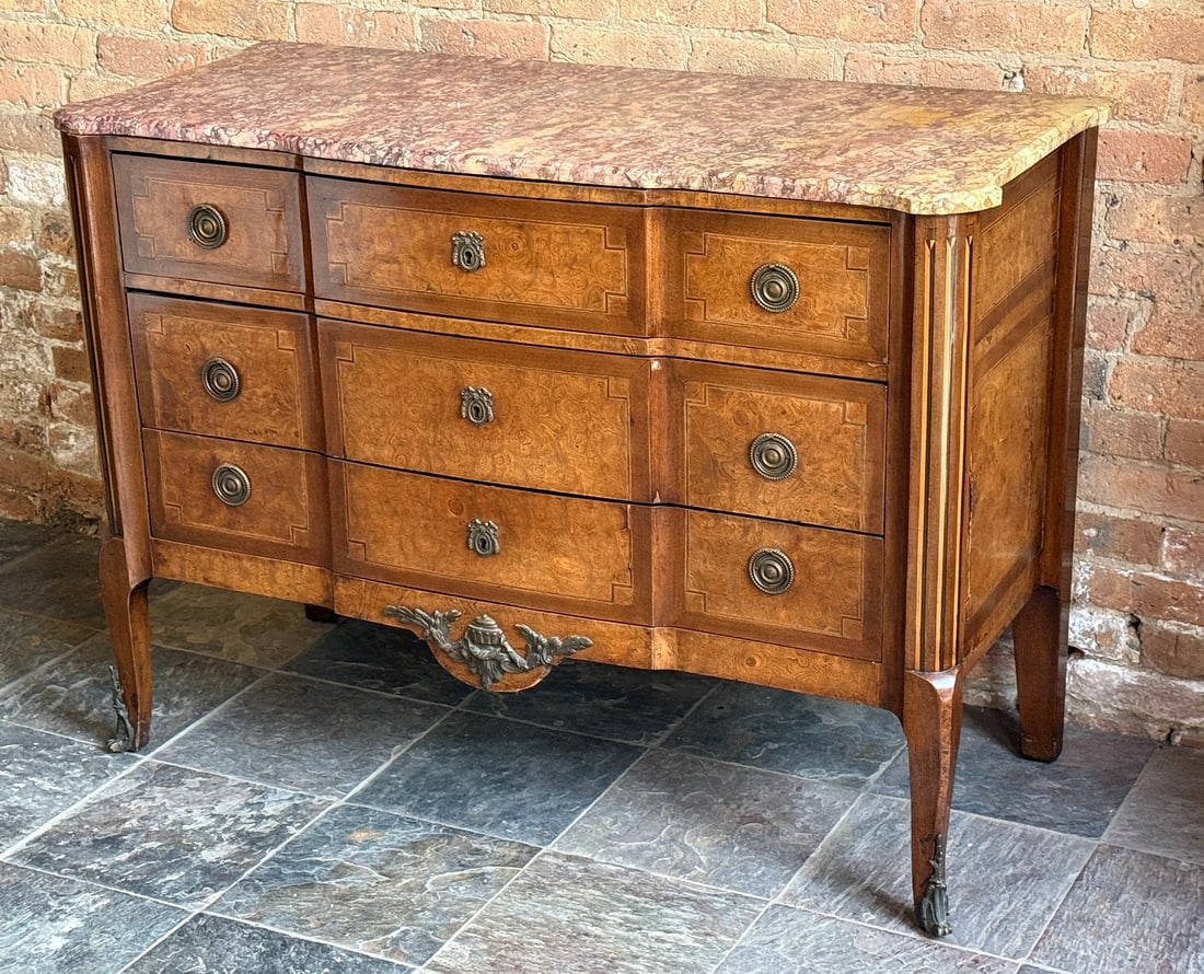 French Louis XV Style Chest of Drawers: Marble top, mixed wood inlaid base. Brass detailing. 34.5" H x 47.75" W x 20.5" D.