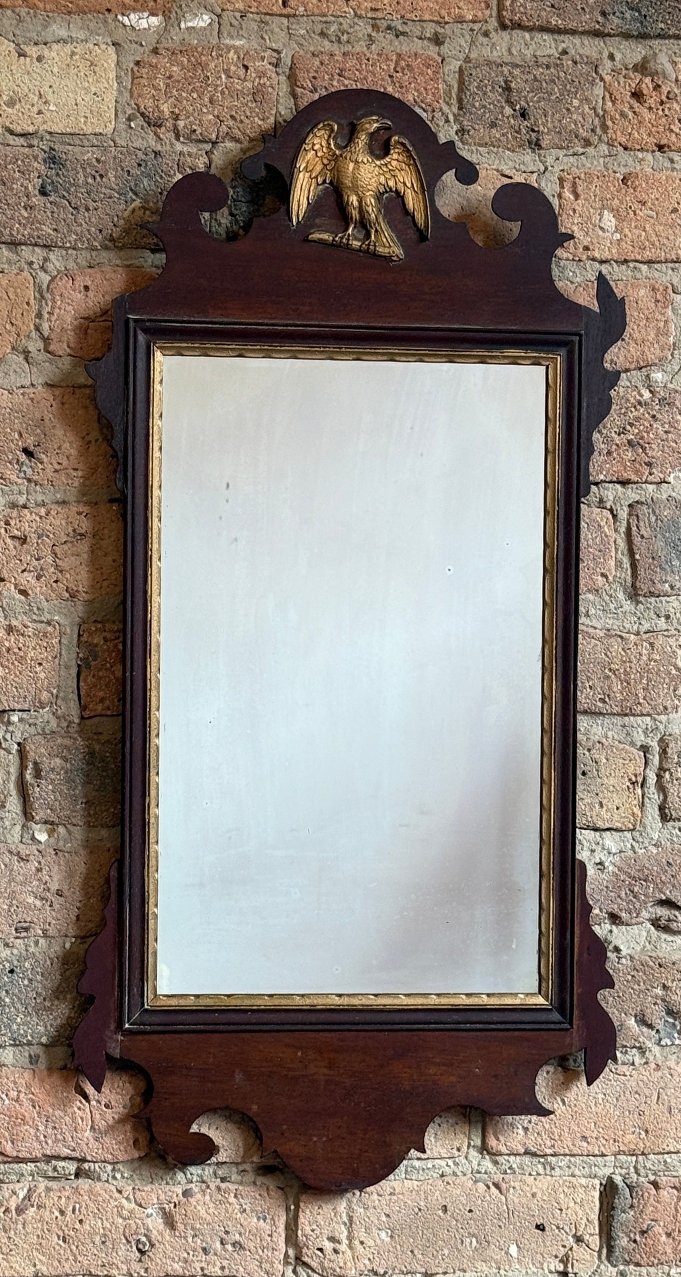 Antique Federalist Style Wall Mirror: Measures 29" x 14.5" x 1" D. Denoted on the back that the mirror may be stamped Aug 8th, 1930.