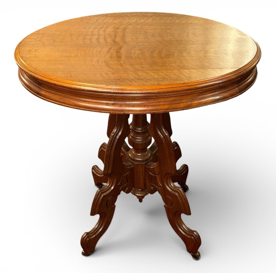 Antique Victorian Renaissance Revival Parlor Table: Measures 30" H x 29" x 22.5". Has wheels on the feet.