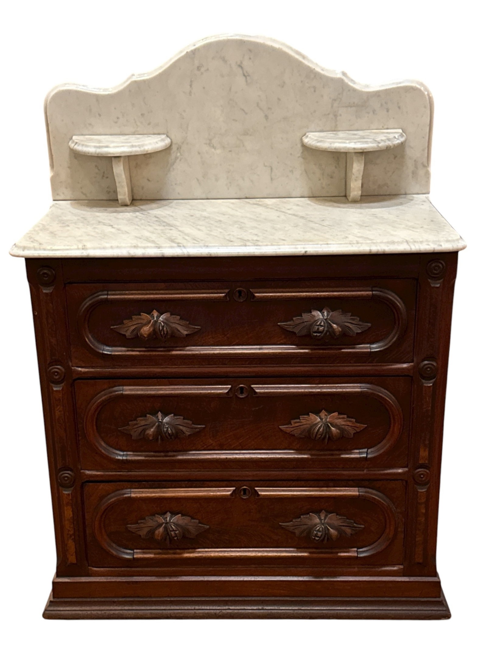 19th C. Victorian Marble Top Commode: Measures 40.5" H to back x 30.5" W x 16"D. Victorian washstand/dry sink/commode. Features three drawers, and two curved candle shelves.
