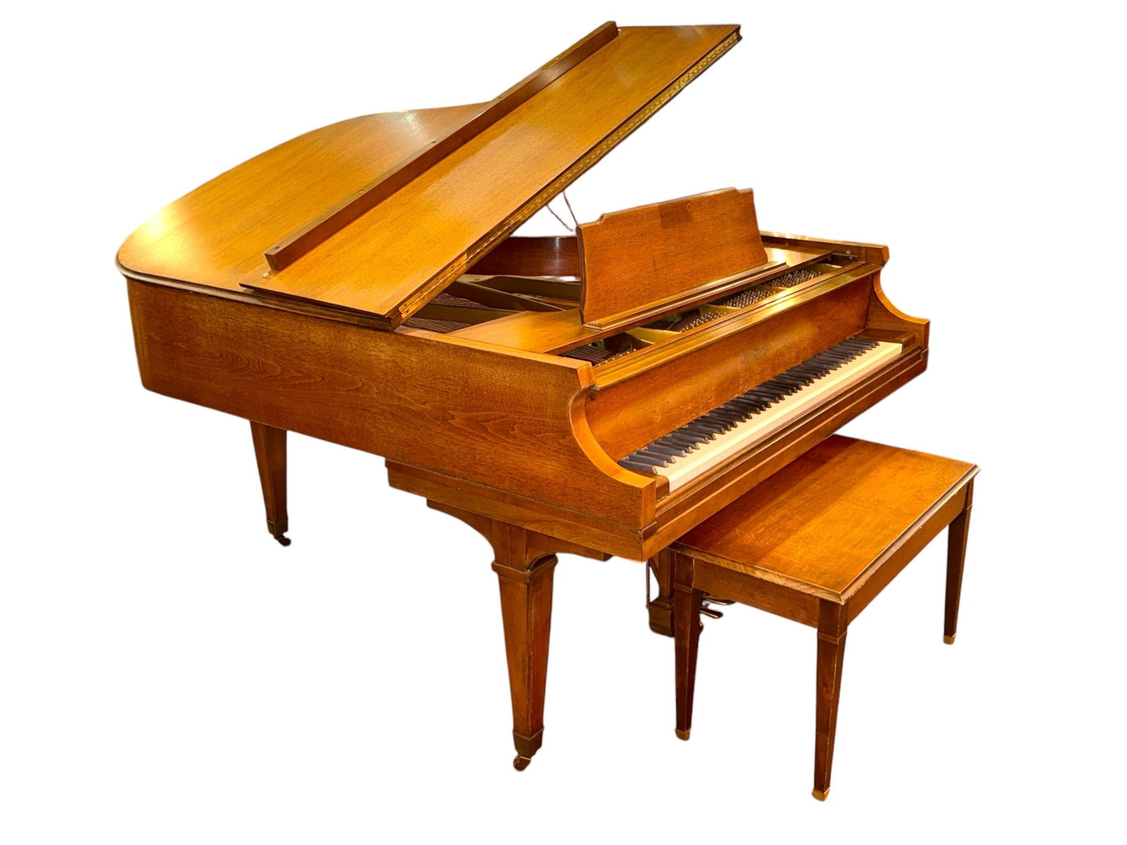 Classic Walnut Baby Grand Piano: Chickering & Sons. Serial Number: 249 941. 31" H x 61" W x 68" D. Bench measures 20" H x 34" W x 15" D.