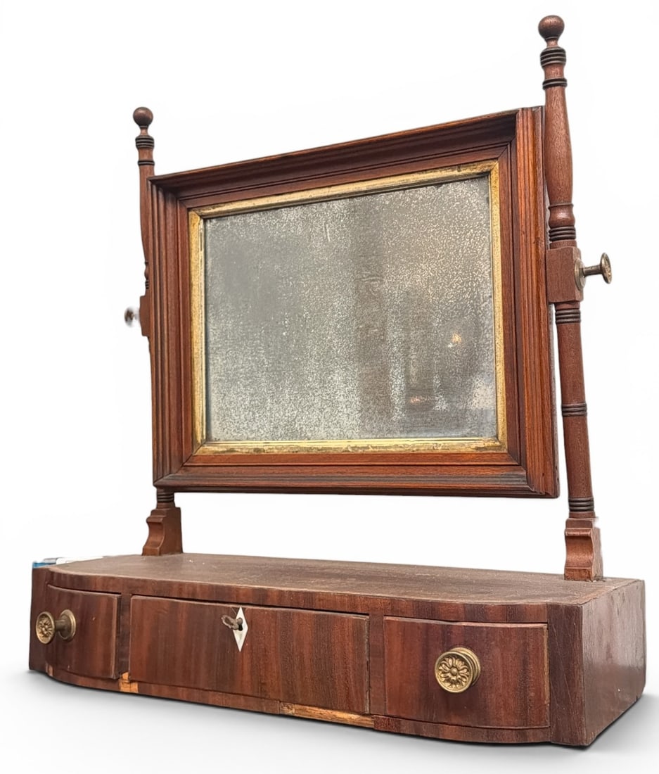 Antique English Mahogany Bowfront Shaving Mirror: Measures 21" H x 19.5" W x 8.25" D. Features mother of pearl inlay and brass floral pulls.