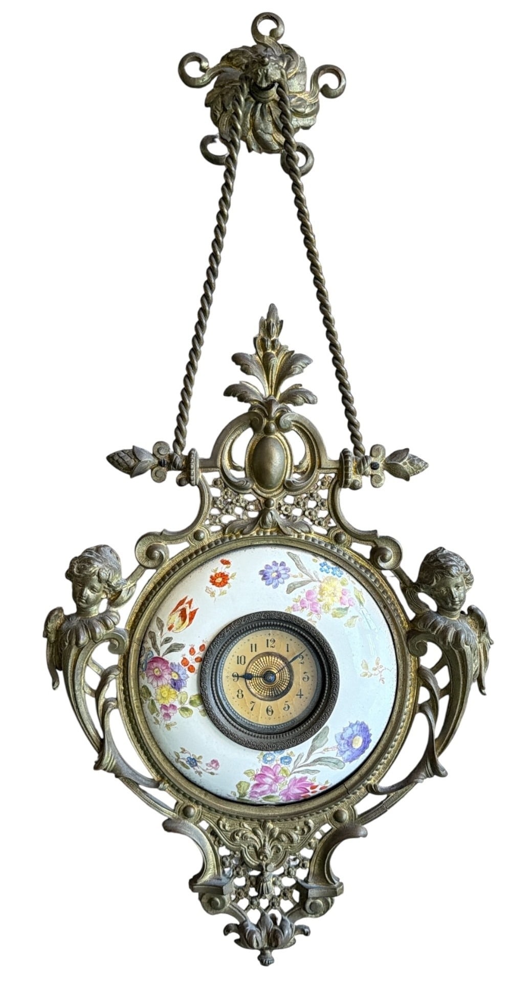 Antique Late 19th C. French Wall Clock: 18" H x 9" W x 1" D. Features hand painted porcelain face and bronze cherub frame. Has not been tested.