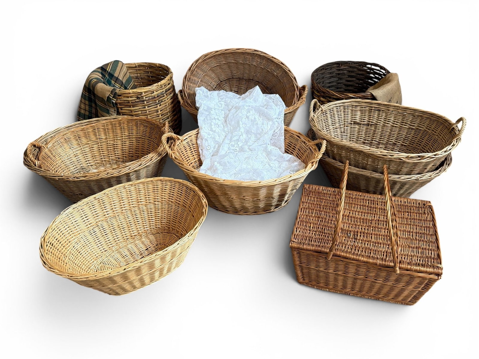 Large Collection Vintage French Wicker Baskets, Quilt: Includes a broad assortment, the tall and narrow baskets measure 17" H x 18" diameter, the picnic basket measures 10" H x 20" W x 14.5" D, and the largest handled basket measures 14.5" H x 30" handle 