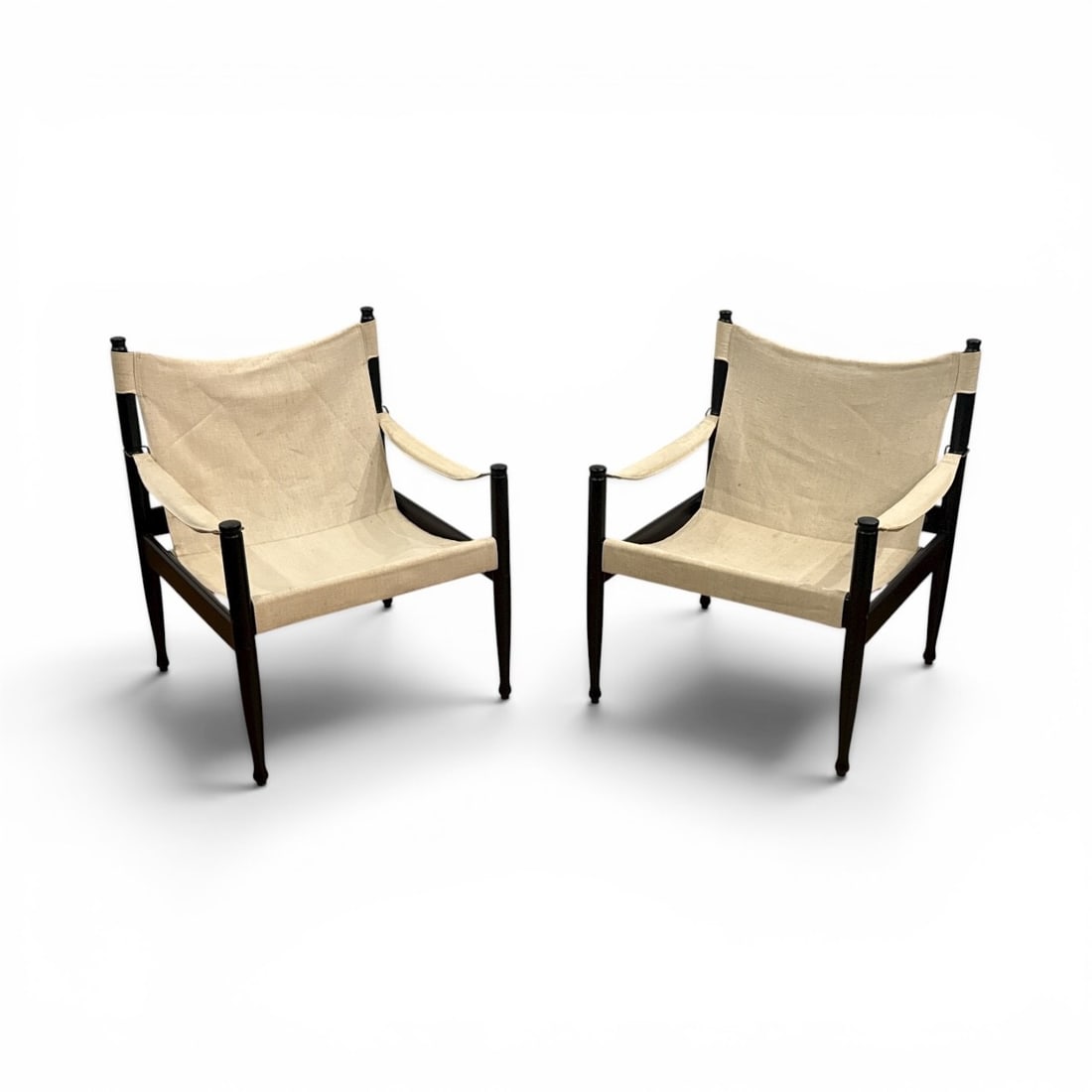 Mid Century Danish Safari Chairs by ERIK WORTS for NIELS EILERSEN: 30.5" H to back x 16" H to seat x 24" W x 24" D. Recently stored frames. One chair retains labels.