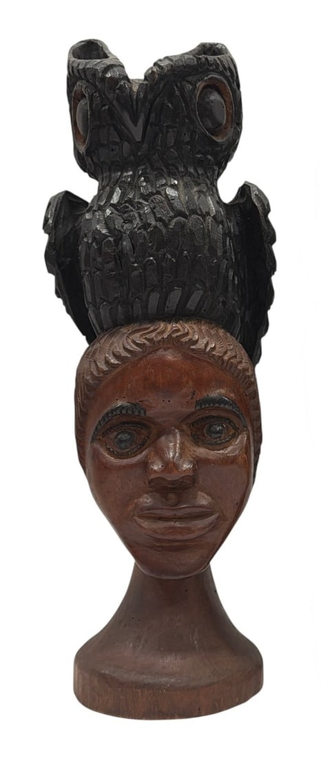 1977 Black Americana Woman and Owl Carved Wood Sculpture: Signed H. Walker and dated 1977 under base. Measures 16.5" H x 6" W x 6" D. A woman with an owl on her head symbolizes deep intuition and hidden wisdom