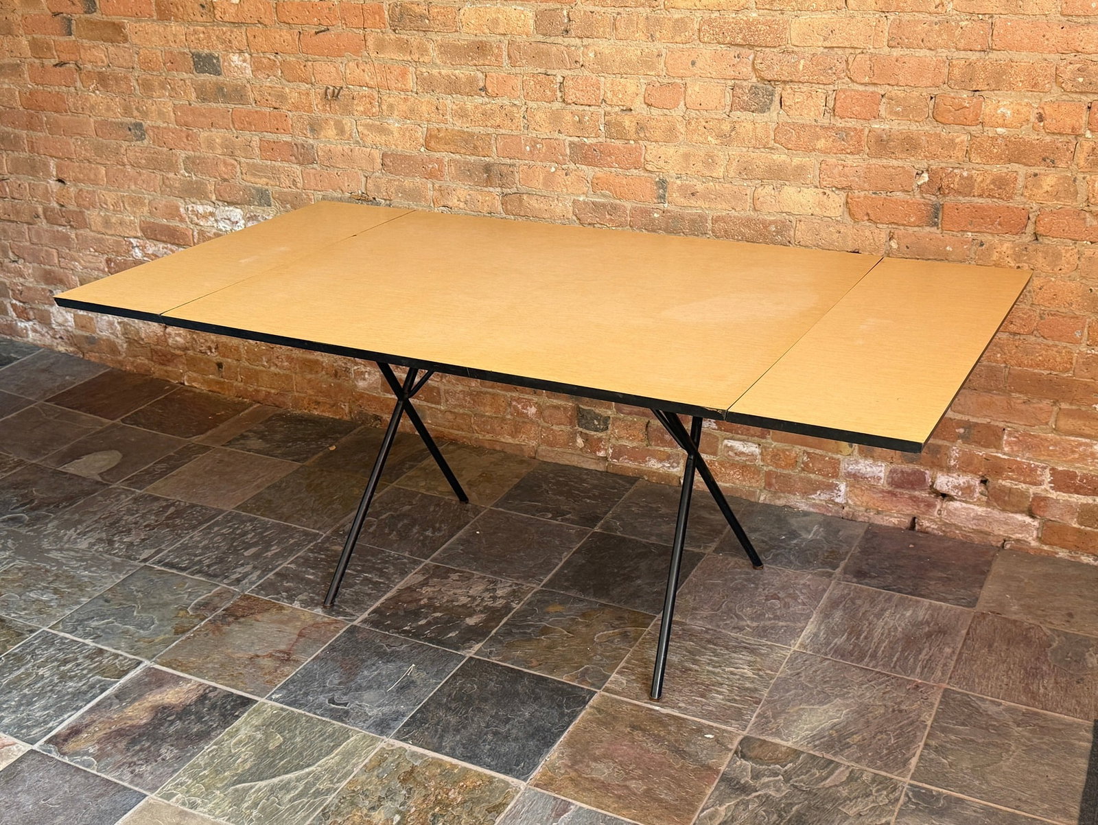 Circa 1950s GEORGE NELSON "X Leg" Dining Table, HERMAN MILLER: Iron base with laminate top. 29" H x 48" L (no leaves) x 72" L (extended w/ both leaves) x 36" D. Comes with 2 leaves. No label.
