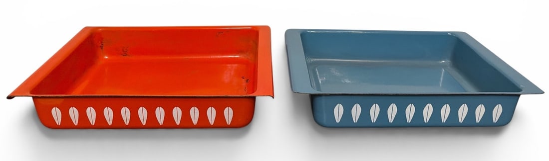 Two CATHRINEHOLM Norway Mid Century Lotus Enamelware Trays: The blue tray measures 2.5" H x 14" W x 9.25" D, the orange one measures 2.5" H x 13.5" W x 9" D.