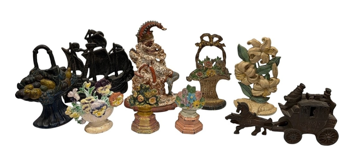 Collection Antique Figural Cast Iron Door Stops: Largest is the "Mr. Punch" doorstop and measures 12.5" H x 9.5" W x 3.5" D. collectible flowers in a basket etc.