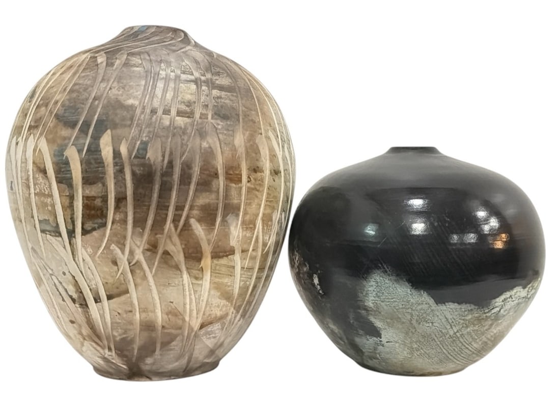 Two Ed Gray [Jikiwe] (Ojibwe, 20th C.) Earthenware Vases: Two Ojibwe Native American Earthenware Vases by Ed Gray (Jikiwe). Both are signed and dated 2002 on the bottom. The larger measures 8" H x 7" diameter, the smaller measures 5" H x 6" diameter.