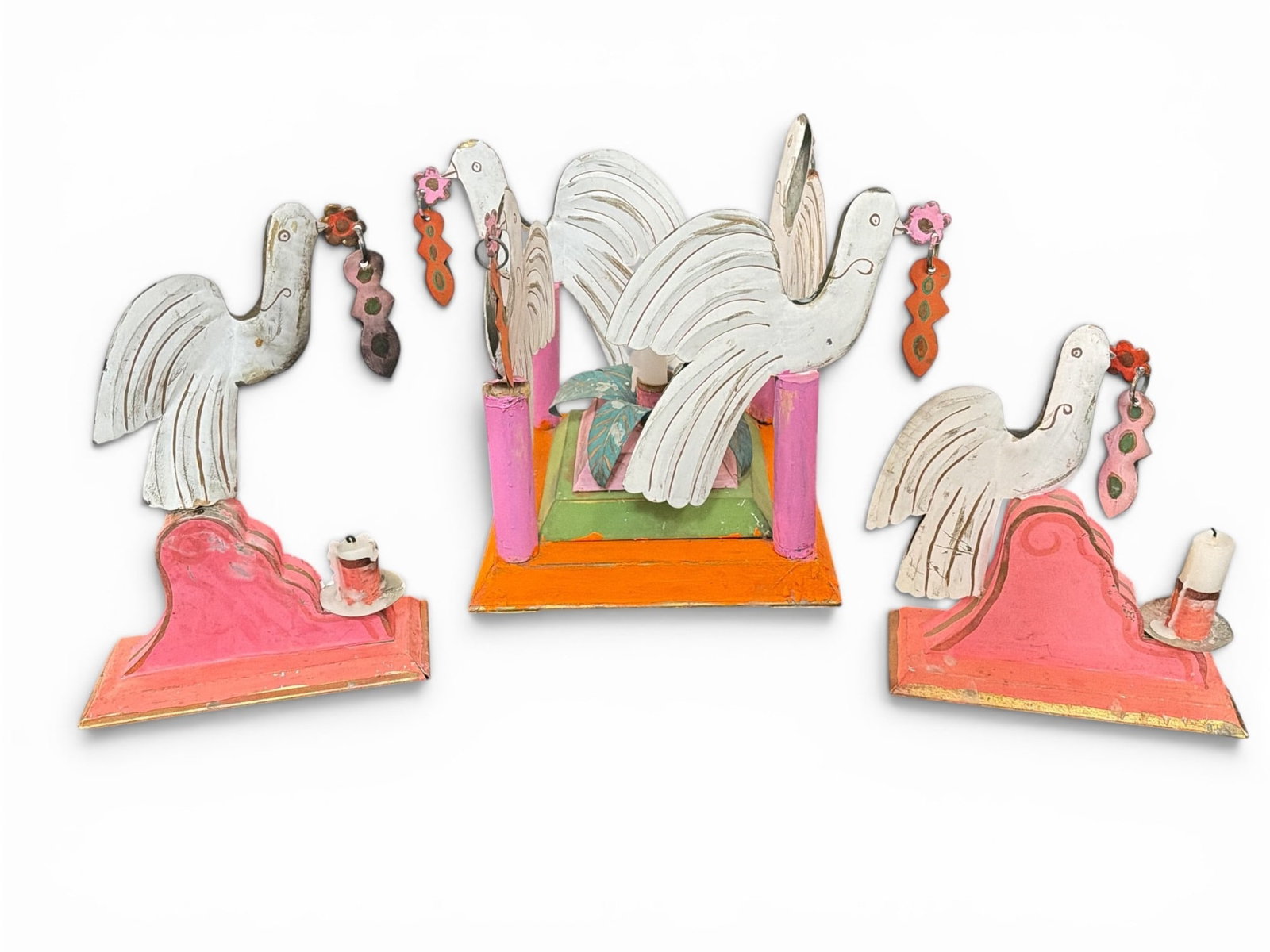 Three Piece Set of Mexican Folk Art Candle Holders: The largest piece measures 11" H x 10.25" W x 10.25" D, the taller of the two smaller pieces measure 11.5" H x 8.25" W x 3.5" D. Property from the Collection of Marjorie and Harvey Freed.