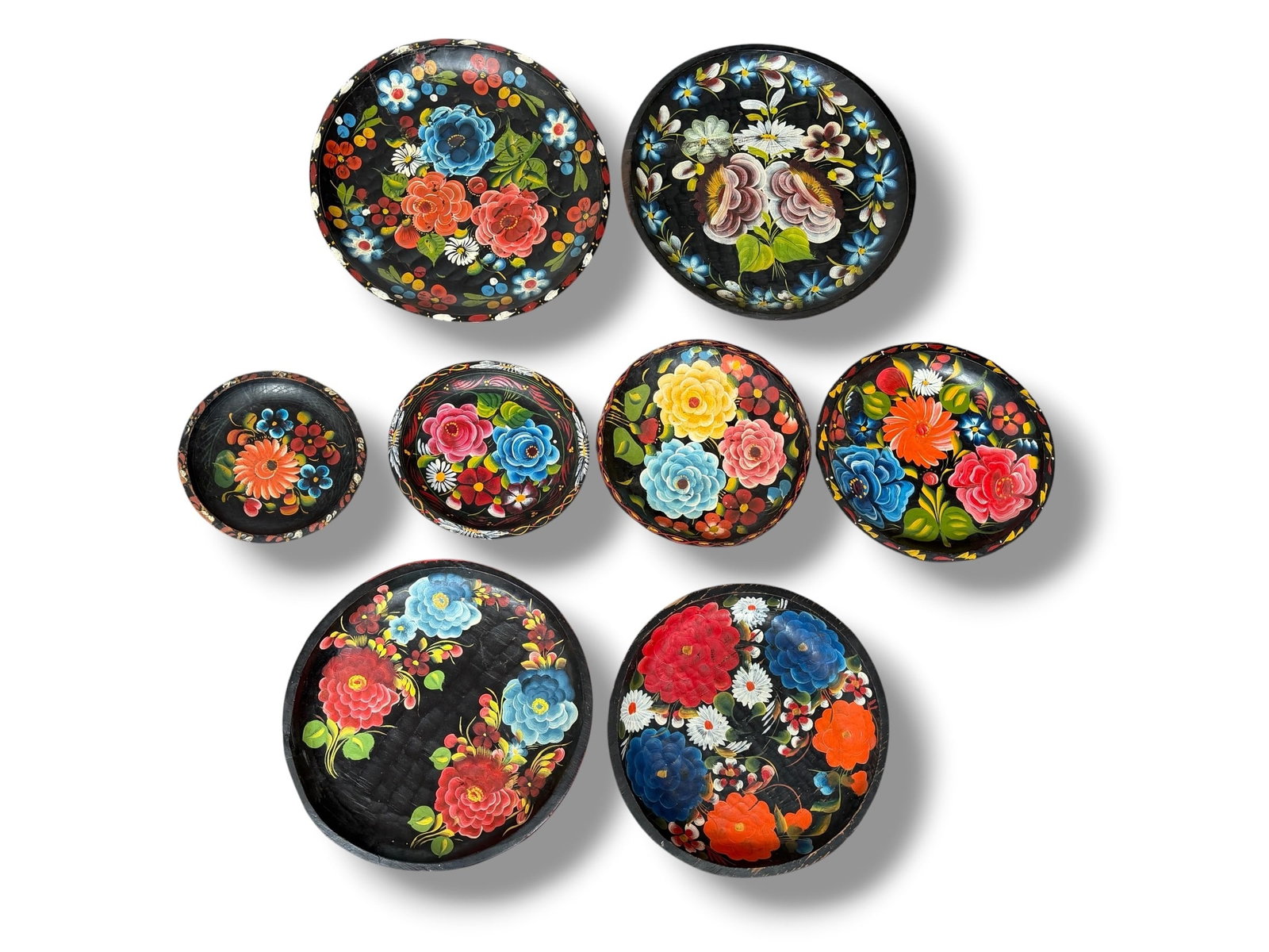 Collection of Mexican Batea Trays: Some are marked Mexico on the underside. The largest measures 2" H x 17.5" diameter, the smallest measures 1." H x 9.25" diameter.