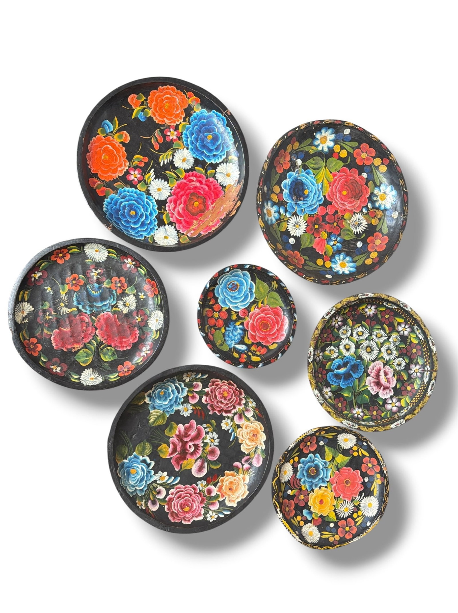 Collection of Mexican Batea Trays: Some are marked Mexico on the underside. The largest measures 2" H x 17.5" diameter, the smallest measures 1." H x 9.25" diameter.