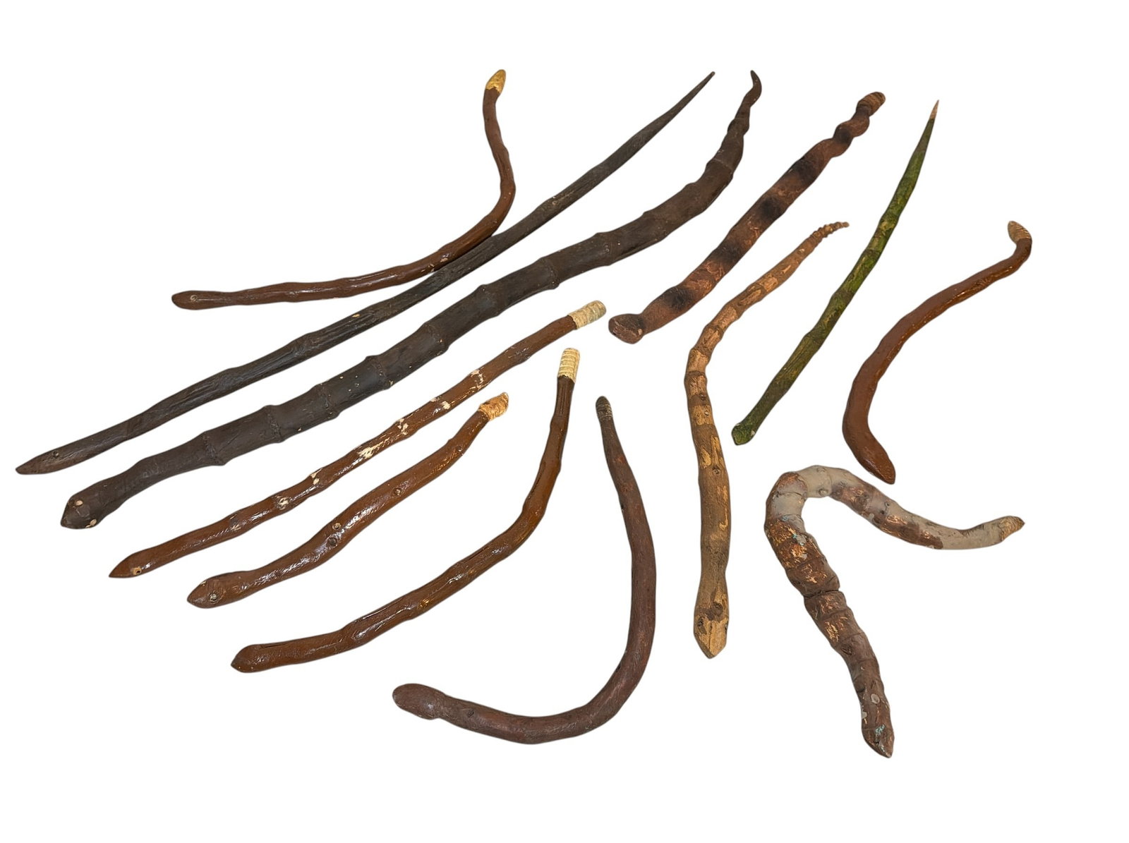 Collection Early 20th C Folk Art Snakes, Texas: Includes an assortment, primarily rattlesnakes. The largest measures 32.5" long x 1.25" diameter, the smallest measures 14" long x 1" diameter. All made from found tree branches and found as a