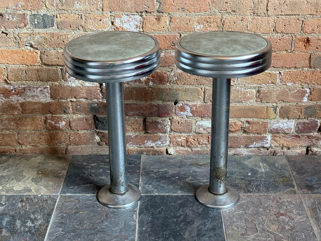 A Pair of Classic Retro Diner Stools: 24" H x 12.5" seat diameter x 6.5" base diameter. From Little Goat Diner in Chicago. Secures to the ground use 4 screws that is covered by the base cap. Base cap slides up to expose the base that