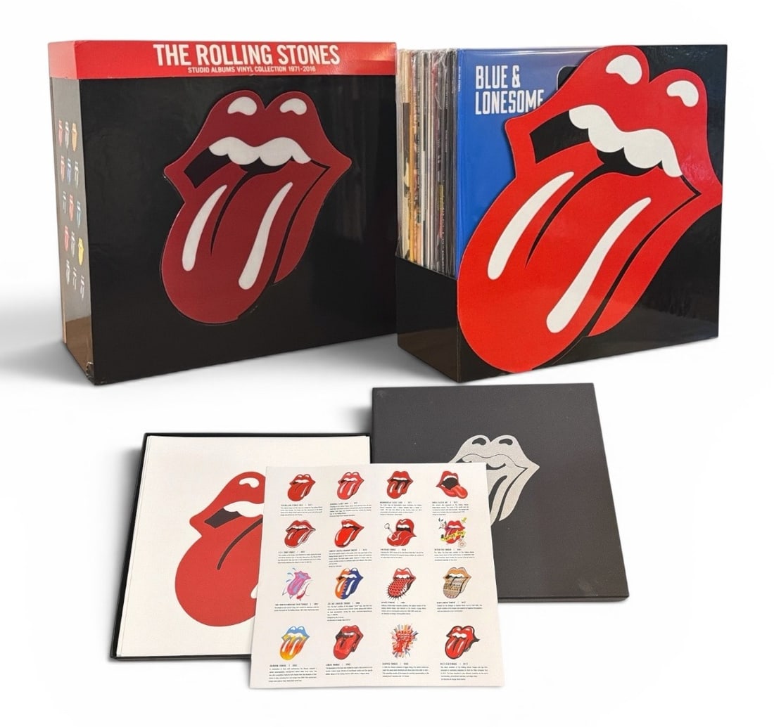THE ROLLING STONES 1971-2016 Vinyl Box Set and Tongue Logo Lithographs: Includes 15 essential studio albums from 1971-2016 in original packaging. Lot also includes tongue logo lithographs from over the years with catalogue sheet.