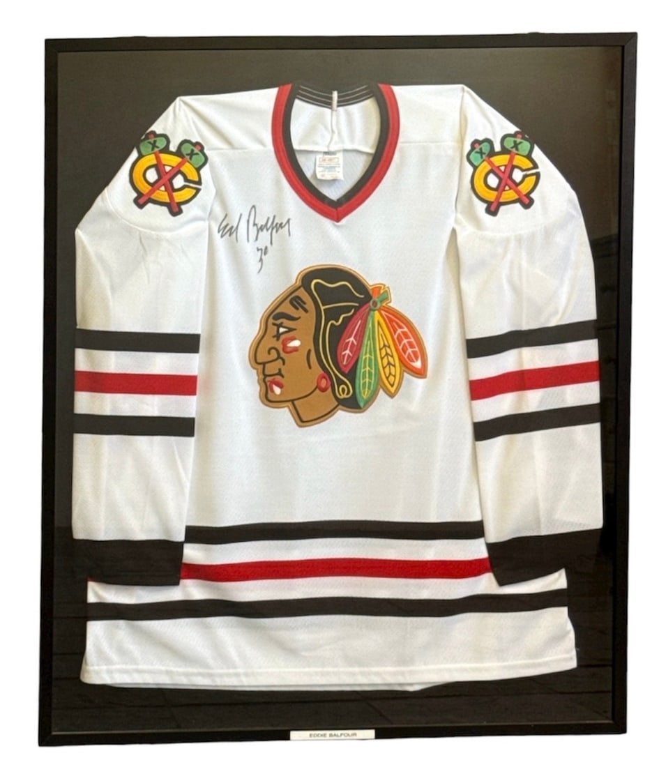 EDDIE BELFOUR Autographed CHICAGO BLACKHAWKS Hockey Jersey: Framed Chicago Blackhawks Goalie Jersey autographed by Belfour. Measures in the frame 37. 5" H x 32. 5" W x 2. 25" D.