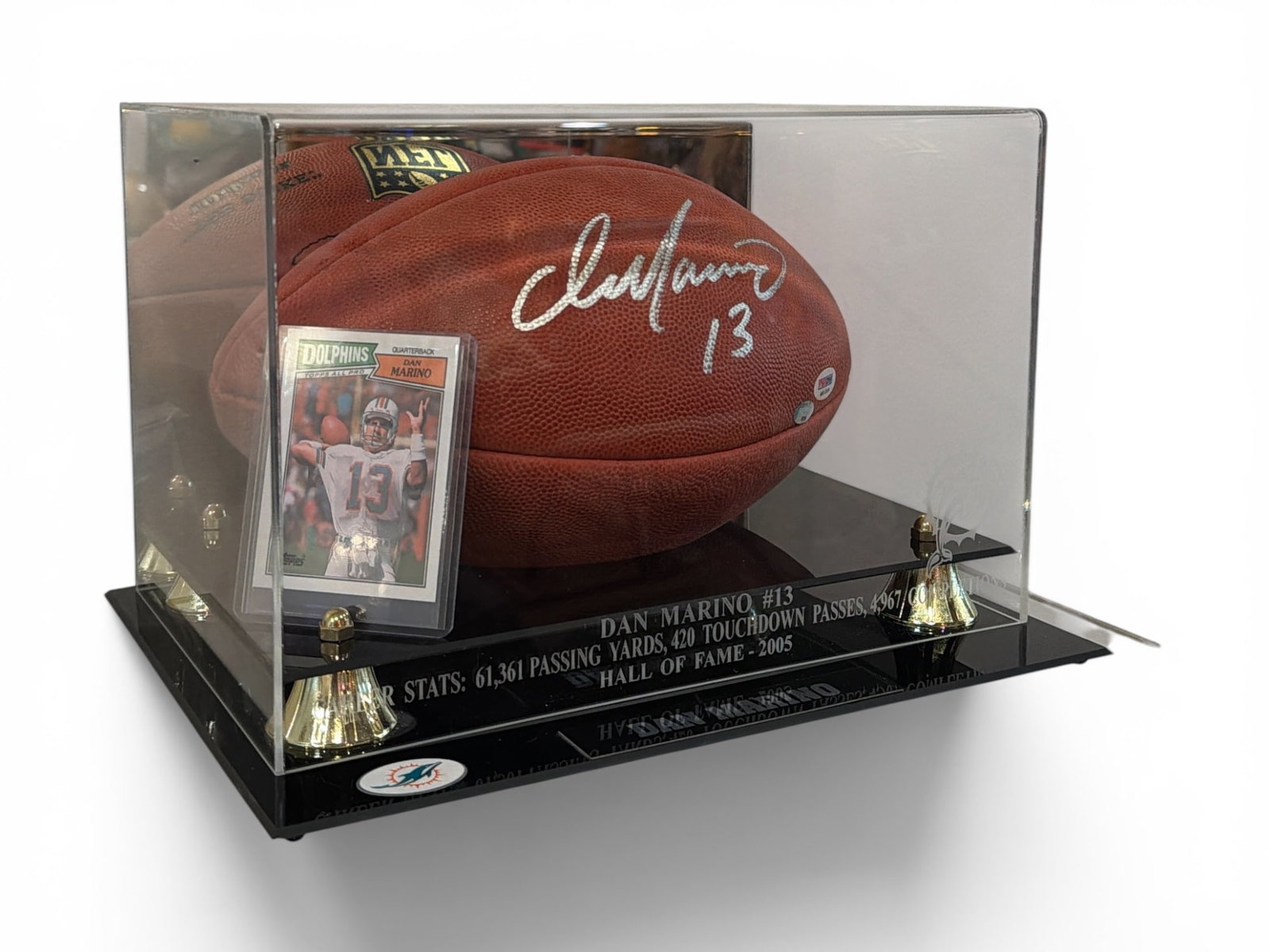 Authentic Autographed DAN MARINO Miami Dolphins Football, PSA COA: Includes the signed football and a Dan Marino Topps #233 card. The football retains a holographic authentication sticker from PSA with certification number M8100 and Sports Memorabilia. com sticker an