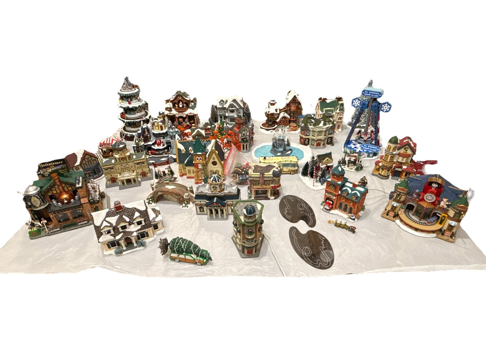 Large Collection Vintage Christmas Village Department 56, LEMAX: Approx. 30 pcs. Some Dept 56, Lemax and others. Tallest piece measures 17" H x 10" diameter. Comes with numerous assorted cords. This lot is available for pickup or must ship via one of our reliable