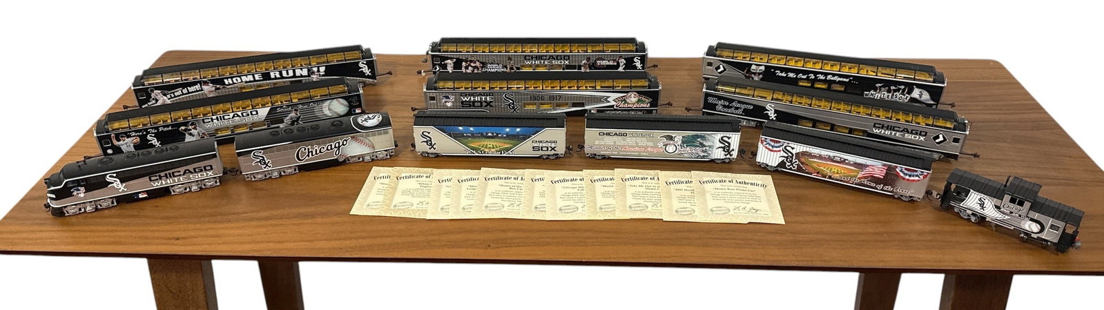 CHICAGO WHITE SOX World Series Hawthorne Village HO Train Set: Complete set of 11 with an additional 12th car. Includes 20 pieces of track and lot comes with a Tech 7 transformer. COAs for set of 11 cars are present.