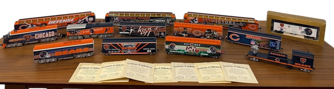 CHICAGO BEARS Hawthorne Village HO Train Set: Set of 13 cars and 7 COAs present. Lot also Includes 23 pieces of track with a Masterpiece Railways transformer.