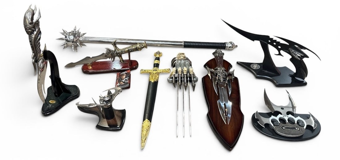 Assortment Cosplay Fantasy Knives, Swords, Etc. KIT RAE: Includes a few Kit Rae fantasy swords. KR10 Kit Rae Umethar Talisman of the Anath. Kit Rae Shadowslayer. Largest pieces measures 36" long.