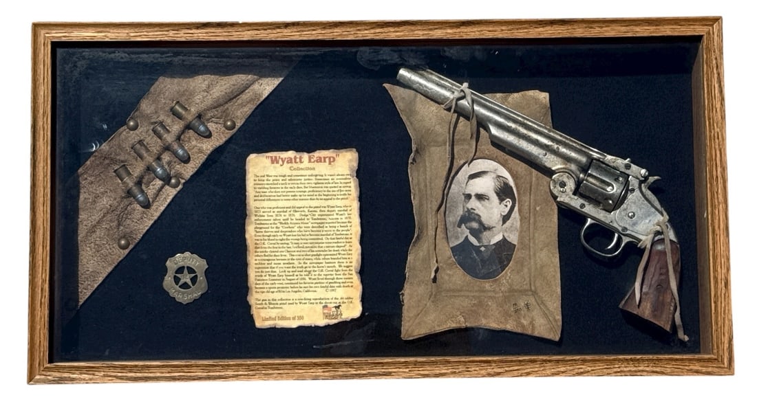 Limited Edition WYATT EARP Replica Western Memorabilia Shadow Box: Shadowbox collection of Wyatt Earp Memorabilia including a reproduction non-firing . 44 caliber Smith & Wesson pistol used in the shoot-out at the O. K. Corral in Tombstone, deputy marshal badge, and