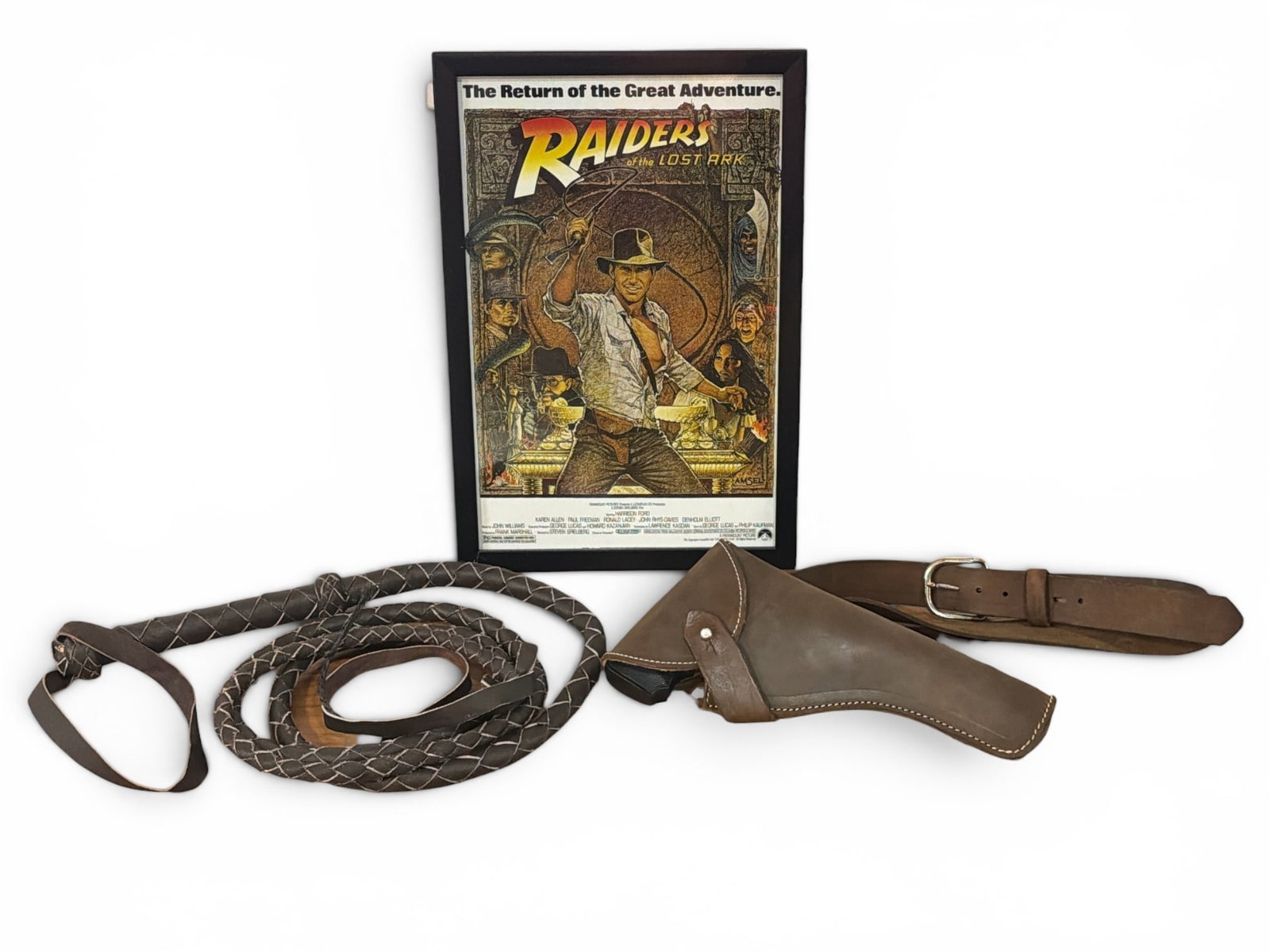 INDIANA JONES Movie Memorabilia Poster Print and Props: Lot includes Raiders of the Lost Ark movie reproduction poster and replica gun holster and whip. Poster measures 18" H x 12" W in the frame.
